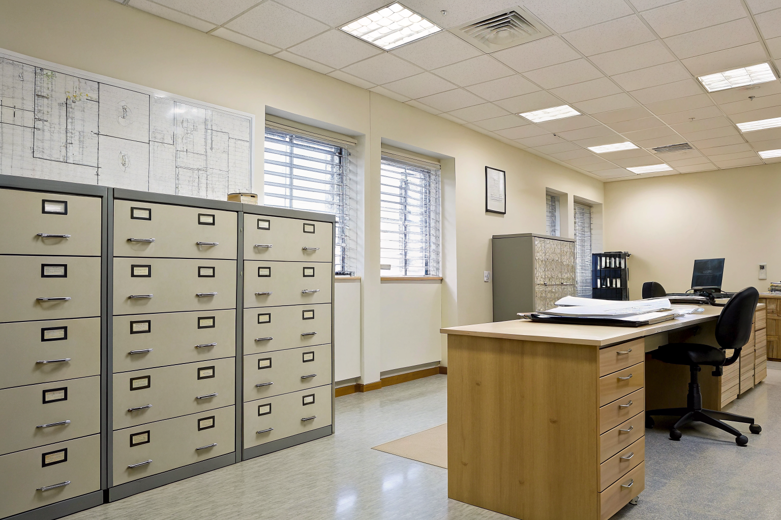 County health department office with filing cabinets and permits.