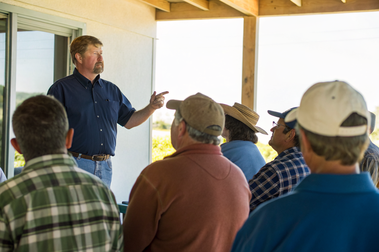 State official explaining septic assistance to residents.